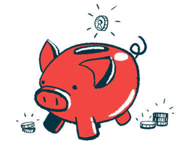 A coin drops into a piggy bank with other coins nearby.