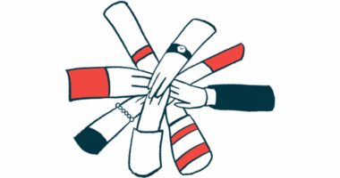 A group of hands come together in a circle.
