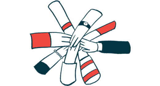 A group of hands join together.