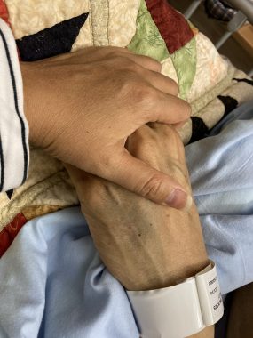 loss of a husband | Amyloidosis News Today | Jaime holds hands with her husband, Aubrey, in the hospital during his final days on earth.