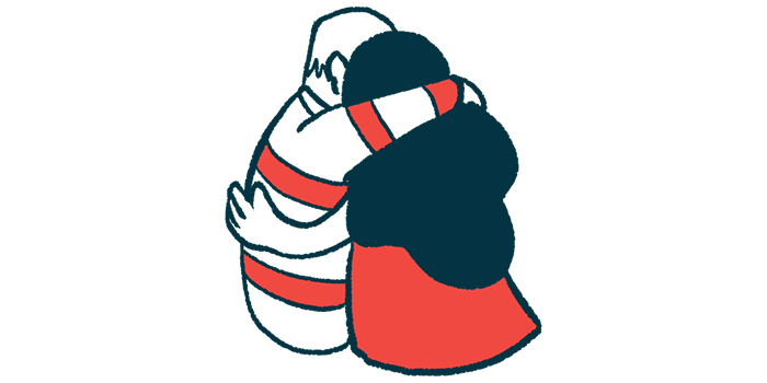 Two people embrace in a side hug.