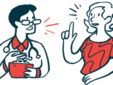 A woman gestures with one hand while talking with a doctor, who holds a clipboard.