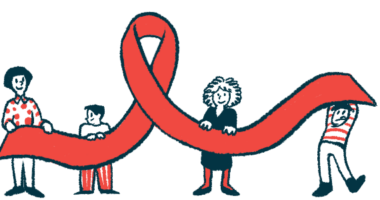 Four people are seen each holding up a section of a large red awareness ribbon.