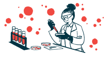 A scientist works with blood and petri dishes in a lab.